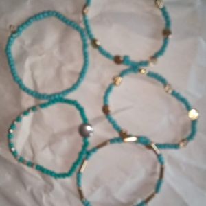 Turquoise Colored Braclets with Gold Accent Beads